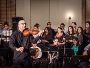 Music Director Hanna Khoury leads audience in "Al-Kamanjat"