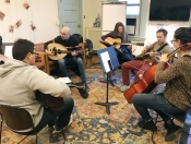 The string group works with instructor Issam Rafea on the first morning