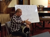 Percussion Director Hafez Kotain teaching the notes